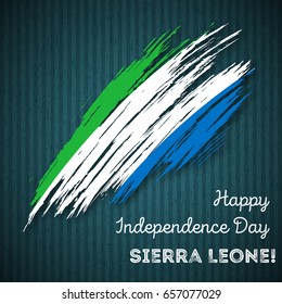 Sierra Leone Independence Day Patriotic Design. Expressive Brush Stroke in National Flag Colors on dark striped background. Happy Independence Day Sierra Leone Vector Greeting Card.