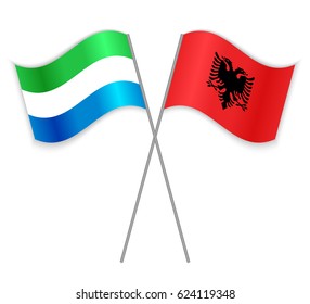 Sierra Leonean and Albanian crossed flags. Sierra Leone combined with Albania isolated on white. Language learning, international business or travel concept.