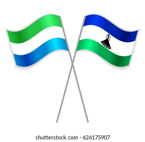Sierra Leonean and Basotho crossed flags. Sierra Leone combined with Lesotho isolated on white. Language learning, international business or travel concept.