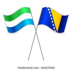 Sierra Leonean and Bosnian crossed flags. Sierra Leone combined with Bosnia and Herzegovina isolated on white. Language learning, international business or travel concept.