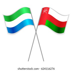 Sierra Leonean and Omani crossed flags. Sierra Leone combined with Oman isolated on white. Language learning, international business or travel concept.