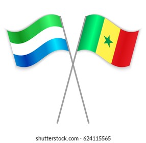 Sierra Leonean and Senegalese crossed flags. Sierra Leone combined with Senegal isolated on white. Language learning, international business or travel concept.