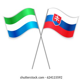 Sierra Leonean and Slovak crossed flags. Sierra Leone combined with Slovakia isolated on white. Language learning, international business or travel concept.