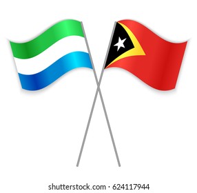 Sierra Leonean and Timorese crossed flags. Sierra Leone combined with East Timor isolated on white. Language learning, international business or travel concept.