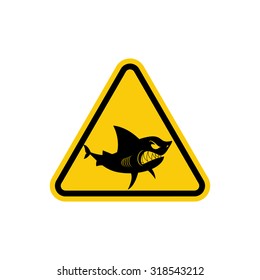 Sign of attention to  sharks. Yellow warning symbol for Ocean. Swimming is prohibited in  waters inhabited by predators
