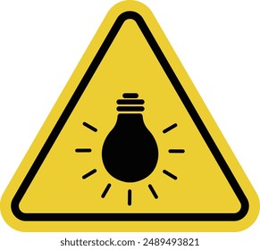 Sign bright light bulb. Sign bright light Warning sign about bright light or bright bulb. The light source may be harmful to the eyes. Incandescent lamp. Warning yellow triangular road sign.