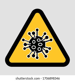 Sign with corona virus bacteria simbol in triangle shape.