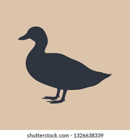 Sign duck. Isolated silhouette duck on beige background. Vector illustration