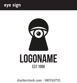 sign eye looking through a keyhole