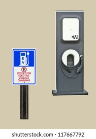 A sign, 'No parking except for Electric Vehicle Charging' sits in front of an EV Charging Station. VECTOR.