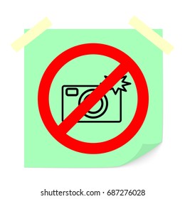 Sign prohibiting use of camera.