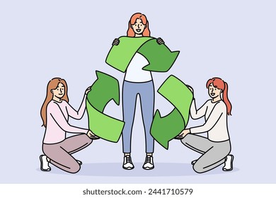 Sign of recycling in hands of women eco-activists calling to save and take care of sustainable development of environment. Symbol of recycling of materials to reduce CO2 emissions.