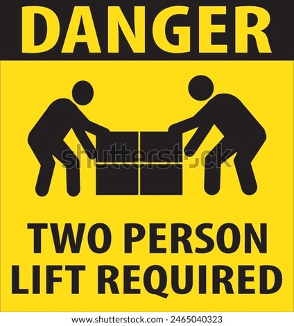 The sign serves as a reminder that handling the item requires the assistance of at least two people to prevent injuries or more severe accidents. 