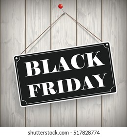 Sign with text Black Friday on the wooden background. Eps 10 vector file.