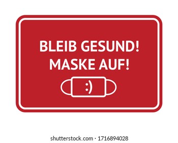 Sign warning to wear medical masks during covid 19 pandemic. Words in German: Bleib gesund! Maske auf. Stay safe, mask on. Social distancing, self-protecting behavior.