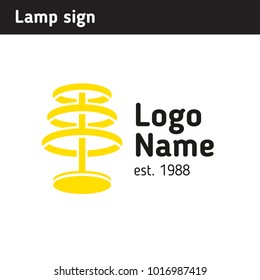 The sign is a yellow lamp, for a luminaires salon or as a metaphor for a good idea