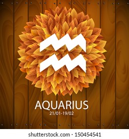 Sign of the zodiac. Aquarius horoscope. white sign with a circle of autumn leaves. Wooden planks background