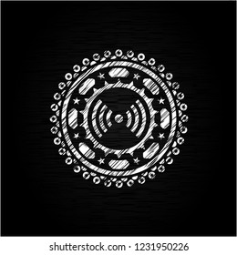 signal icon inside chalkboard emblem on black board