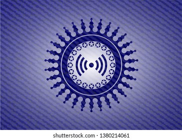 signal icon inside emblem with denim texture