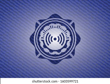 signal icon inside emblem with denim texture