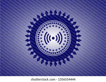 signal icon inside emblem with jean background