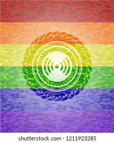 signal icon inside emblem on mosaic background with the colors of the LGBT flag