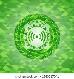 signal icon inside green emblem with triangle mosaic background