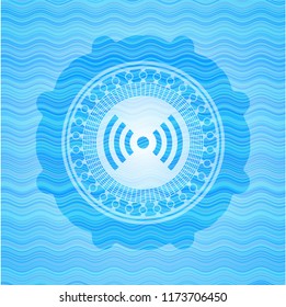 signal icon inside light blue water wave badge.