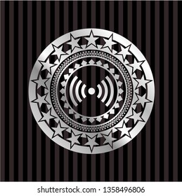 signal icon inside silvery emblem