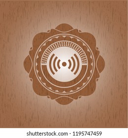 signal icon inside vintage wood emblem