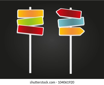 Signs with arrows, red, green, blue and orange isolated on black background