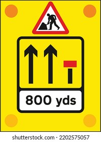 Signs used on the back of slow-moving or stationary vehicles warning of a lane closed ahead by a works vehicle. There are no cones on the road., The Highway Code Traffic Sign, Signs giving orders