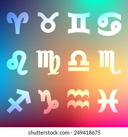 signs of the zodiac on a rainbow blurred background