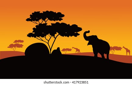 Silhhouette of elephant in park with tree and giraffe