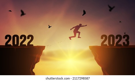 Silhouette of 2023 New year young man jumping to Happy new year concept. Jump over a cliff 2022 and 2023 years over the sun and through on the gap of hill evening sky. Vector welcome New Year 2023.