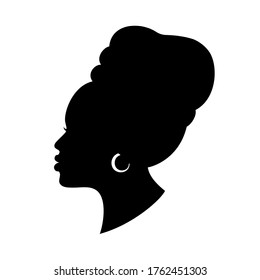 Silhouette of African American woman in a head wrap and with an earring.  Beautiful black girl profile. Vector fashion illustration isolated on white. 