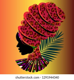 Silhouette of an African woman in a massive headdress. Leopard print.