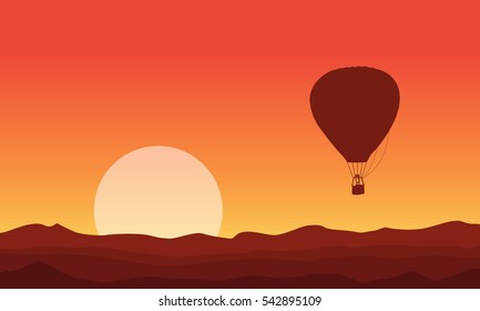 Silhouette of air balloon at sunset