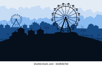 Silhouette of amusement park scenery at night