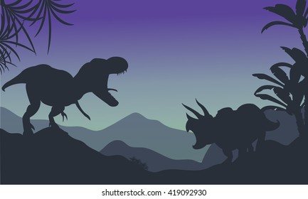 Silhouette of ankylosaurus and tyrannosaurus at the night