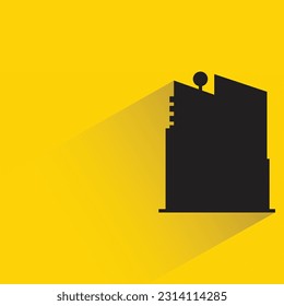 silhouette apartment building icon with shadow on yellow background