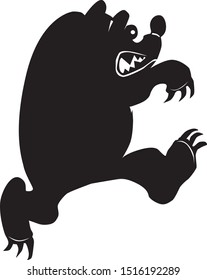  silhouette of an attacking bear from the forest