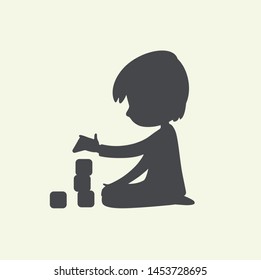 Silhouette of Baby Boy playing with toy blocks. Can be used as logo or sign. Vector Black and white illustration. isolated.