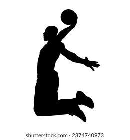 Silhouette of a basket ball player in action pose. Silhouette of a male basket ball athlete.