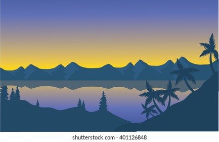 Silhouette of beach and hills at sunset