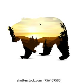 Silhouette of bear with background of mountains panorama. Colorful sunset in wild valley. Windy sky. Brown tones.