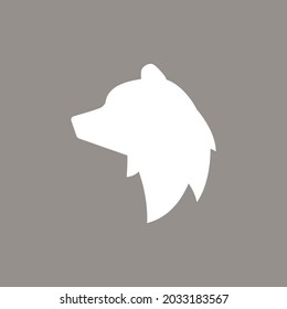 Silhouette of bear head. vector flat icon isolated on brown background. grizzly logo.  wild, power, nature, winter symbol. 