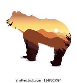 Silhouette of bear with mountain landscape. Sunset.