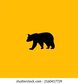 Silueta de un oso de fondo amarillo