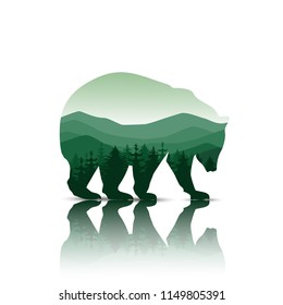 Silhouette of bear with panorama of mountains. Green tones. Walking on the ice.